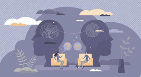 Imagem de duas pessoas sentadas e conversando, atrás duas cabeças desenrolando fio